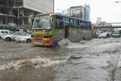 A bus moves through rain water on Mirpur road in Dhanmondi area of Dhaka after heavy rain on Monday, July 20, 2020 | Rajib Dhar/Dhaka Tribune