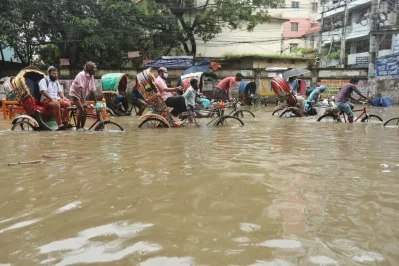 Rickshaws wade through rainwater on submerged road at Green Road area in Dhaka on Monday, July 20, 2020 | Rajib Dhar/Dhaka Tribune