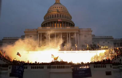 An explosion caused by a police munition is seen while supporters of U.S. President Donald Trump gather in front of the US  Capitol Building in Washington, US, January 6, 2021 Reuters