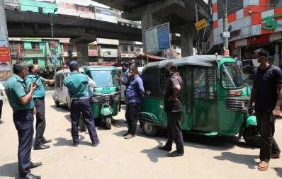 Traffic police fines public transports on the streets of Dhaka for violating lockdown rules on the first day of the week-long lockdown on Monday Mehedi Hasan/Dhaka Tribune