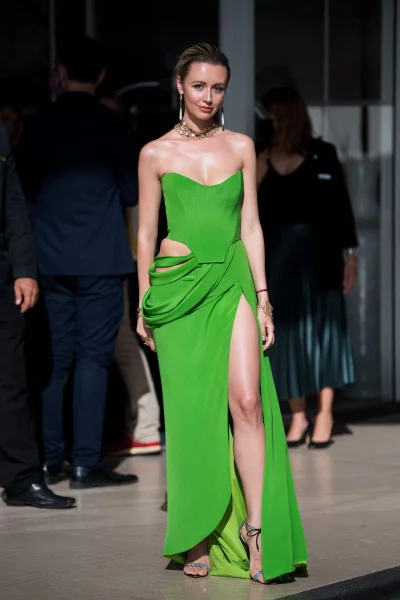 Nataly Osmann in a green slitted dress.nnn