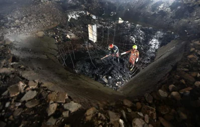 Aftermath of Narayanganj factory fire as firefighters work to put out small fires that reignited from embers in the debris Mehedi Hasan/Dhaka Tribune