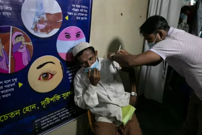 nA Rohingya man being inoculated against Covid-19 at a refugee camp in Coxs Bazar, Bangladesh, on Wednesday, August 11, 2021 Allison Joyce/Dhaka Tribunen
