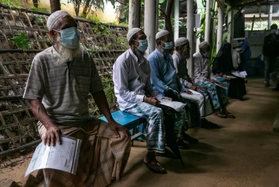 Rohingyas wait in queue to receive their Covid-19 jab at a refugee camp in Coxs Bazar, Bangladesh, on Wednesday, August 11, 2021 Allison Joyce/Dhaka Tribune