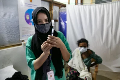 A nurse prepares a syringe with Covid-19 vaccine at a vaccination centre for Rohingyas in Coxs Bazar, Bangladesh, on Wednesday, August 11, 2021 Allison Joyce/Dhaka Tribune