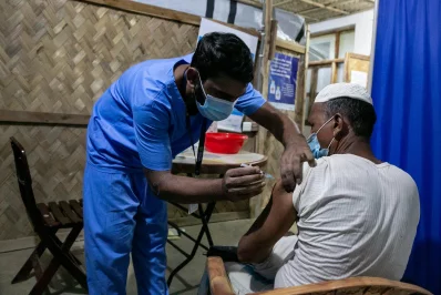 A Rohingya man being inoculated against Covid-19 at a refugee camp in Coxs Bazar, Bangladesh, on Wednesday, August 11, 2021 Allison Joyce/Dhaka Tribune