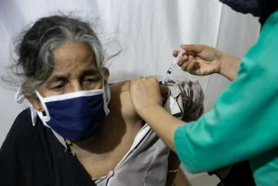 nA senior Rohingya woman being inoculated against Covid-19 at a refugee camp in Coxs Bazar, Bangladesh, on Wednesday, August 11, 2021 Allison Joyce/Dhaka Tribunen
