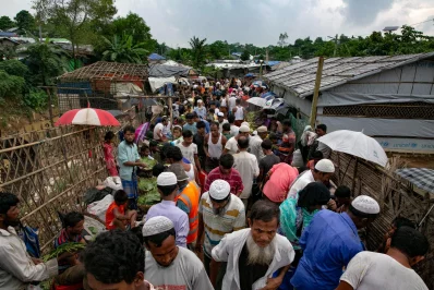 nPeople walk through a marketplace at a Rohingya refugee camp in Coxs Bazar, Bangladesh, on Wednesday, August 11, 2021 Allison Joyce/Dhaka Tribunen