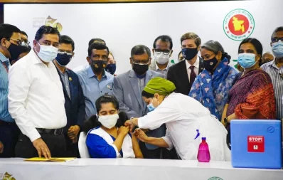 Education Minister Dipu Moni and Health Minister Zahid Maleque watching a student receive a vaccine shot at the Ideal School and College centre in Dhakas Motijheel where inoculation of school students took off on Monday, November 1, 2021 Mehedi Hasan/Dhaka Tribune