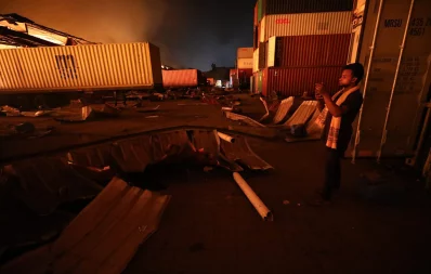 A man is seen at the scene of a fire at BM Container Depot in Sitakunda upazila in Chittagong on Saturday, June 5, 2022 Dhaka Tribune