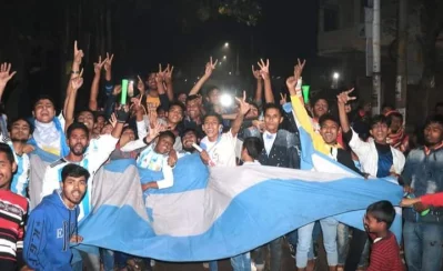 Argentina football team fans donning the iconic light blue and white of La Albiceleste while carrying huge flags while holding a victory Dhaka Tribune