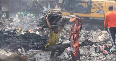 In pictures: Cleaning work continues while locals collect scraps from Bangabazar fire site