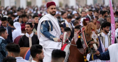 A man in traditional dress attends a carnival on his horse to celebrate Eid-ul-Fitr in a public square in Benghazi, Libya April 21, 2023  Reuters
