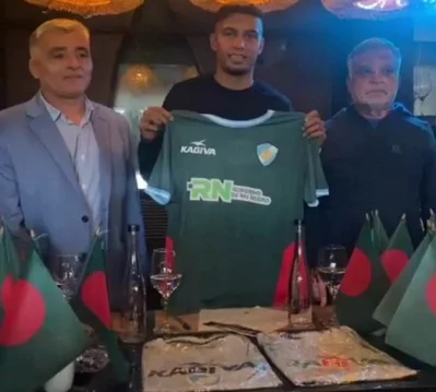 Jamal Bhuiyan poses with a Sol de Mayo jersey after signing for the Argentine club Friday Photo: Collected