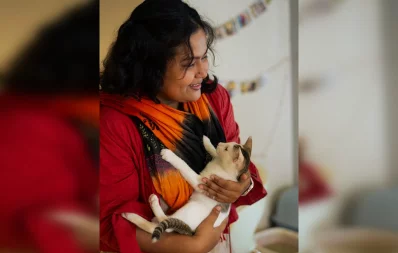 The image shows a woman hugging a cat. Photo: Joyeeta Trisha and Anirban Kaiser/Grameenphone