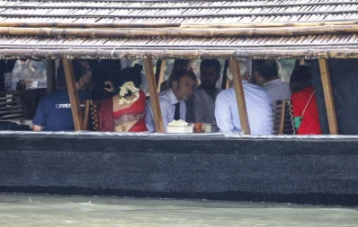 France`s President Emmanuel Macron (C) takes a boat ride during his two-day visit in Dhaka on September 11, 2023. Photo: AFP