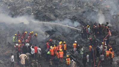 The undated image shows firefighters working to extinguish Bangabazar flames in Dhaka. Photo: Mahmud Hossain Opu/Dhaka Tribune