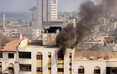 A fire rages on the top floor of a building hit by an Israeli airstrike on October 11, 2023 in Gaza City, as raging battles between Israel and the Hamas movement continued for the fifth consecutive day. Photo: AFP