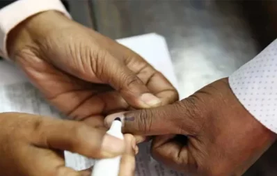 The undated image shows a polling agent marking on a voter`s hand after casting vote. Photo: Collected