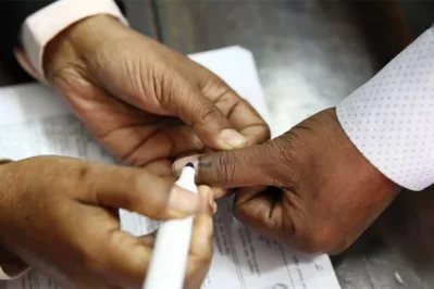 The undated image shows a polling agent marking on a voter`s hand after casting vote. Photo: Collected