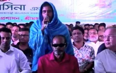  A beneficiary Jahanara Begum shares her joy with Prime Minister Sheikh Hasina at the inauguration program in Moulvibazar on Monday, October 16, 2023. Photo: Dhaka Tribune