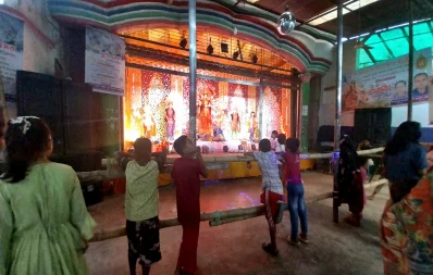 Children are seen standing  in front of a mandap in Dhaka on Monday, October 23, 2023. Photo: Famiha Suhrawardy/Dhaka Tribune