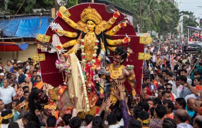 People carries the idol of goddess Durga as Durga Puja, the biggest festival of Bengali Hindus, comes to an end at Sadarghat in Dhaka on Tuesday, October 24, 2023. Photo: Mahmud Hossain Opu/Dhaka Tribune