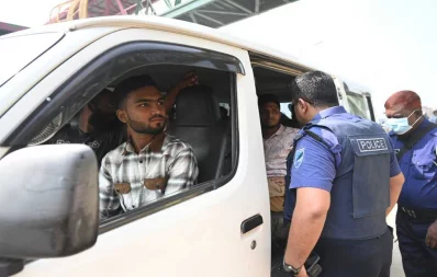 Police search a microbus  in the Aminbazar area ahead of the rallies scheduled for Saturday. Photo: Mehedi Hasan/Dhaka Tribune