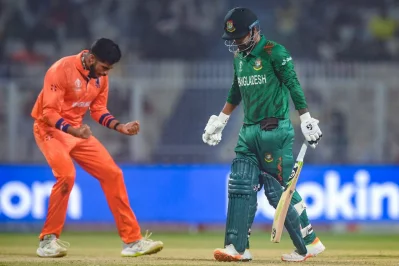 Bangladesh’s Liton Das walks back as the Netherlands’ Aryan Dutt celebrates after taking his wicket during Saturday’s World Cup match in Kolkata Photo: AFP