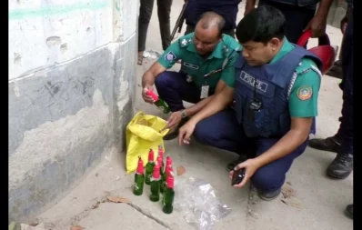 Police members recover petrol bombs from a bag in Rangpur on Sunday, October 29, 2023. Photo: Dhaka Tribune