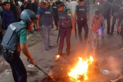 The fire of torches carried by BNP supporters is doused by police in Sylhet on Wednesday, November 15, 2023. Photo: Dhaka Tribune