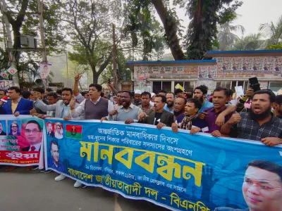The image shows a glimpse of a human chain formed by leaders and activists of BNP in front of National Press Club (JPC) in Dhaka on Sunday, December 10, 2023. Photo: Mahmud Hossain Opu/Dhaka Tribune