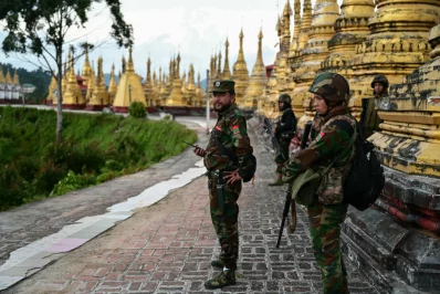File photo: Members of ethnic minority armed group Taang National Liberation Army standing guard in a temple area of a hill camp seized from Myanmars military in Namhsan Township on December 13, 2023. Photo: AFP