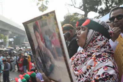 The image shows a glimpse of a symbolic road march program held in Dhaka on Saturday protesting recent arson attacks, December 23, 2023. Photo: Mahmud Hossain Opu/Dhaka Tribune