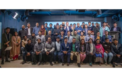 Participants, guests, pose for a photograph at a workshop at the Kennedy Hall of EMK Centre on Thursday, December 28, 2023. Photo: Dhaka Tribune
