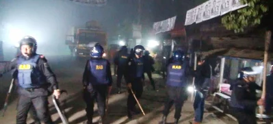 The image shows members of RAB taking action in Jamalpur after an attack on Wednesday night, January 4, 2023. Photo: Dhaka Tribune