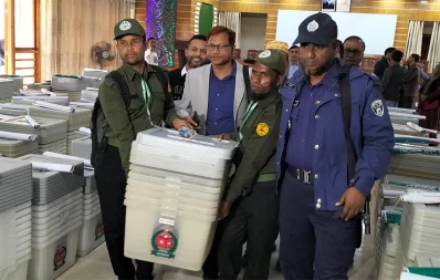 The image shows election equipment being distributed to presiding officers in Jamalpur on Saturday, December 6, 2024. Photo: Dhaka Tribune
