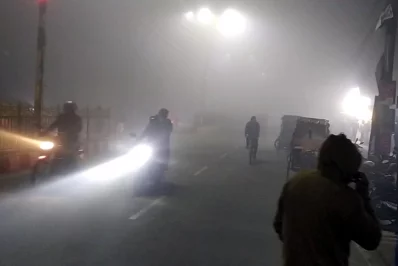 This undated image shows people riding bikes on a foggy winter evening. Photo: Dhaka Tribune