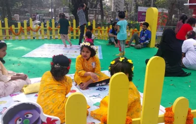 The image shows children`s playful engagement at Amar Ekushey Book Fair 2024 in Dhaka on Friday, February 2, 2024. Photo: Dhaka Tribune