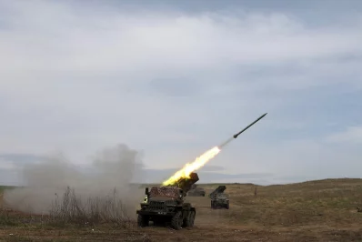 A Ukrainian multiple rocket launcher BM-21 &lsquo;Grad&rsquo; shells Russian troops&rsquo; position, in the Donbas region. Photo: AFP