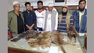 Officials from environmental organization and locals pose for a photograph with endangered species recently. Photo: Bangla Tribune