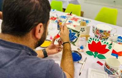 An artist is seen painting during rickshaw art workshops in Dhaka on Sunday, March 10, 2024. Photo: Courtesy