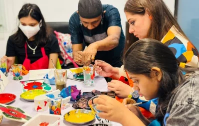 Some artists are seen painting glasses during rickshaw art workshops in Dhaka on Sunday, March 10, 2024. Photo: Courtesy