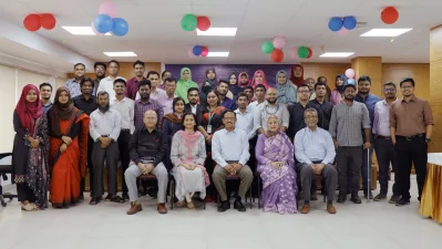 Panelists and participants pose for the group photo.