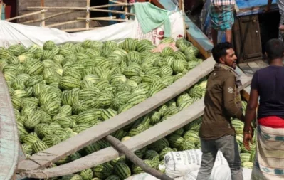 A boat with fresh watermelons is seen at the dock in Barisal. Photo: Dhaka Tribune