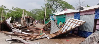Several houses are damaged during a nor’wester in Lalmohan upazila in Bhola on Sunday, April 7, 2024. Photo: Dhaka Tribune