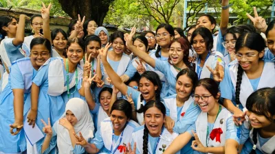 Students show victory sign after getting their SSC results at Viqarunnisa Noon School and College in Dhaka on Sunday, May 12, 2024. Photo: SK Sharifuddin Ahad/Dhaka Tribune