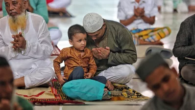A father and a son pray on the occasion of Eid-ul-Azha at the Baitul Mukarram National Mosque in Dhaka on Monday, June 17, 2024. Photo: Ahadul Karim Khan/Dhaka Tribune