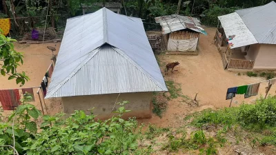 The images shows the houses of tea workers which at risk of landslide in Moulvibazar due to illegal hill cutting. Photo: Dhaka Tribune 