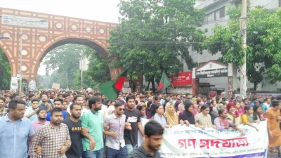 Agitating students of Dhaka University hold a protest march on Tuesday, July 2, 2024. Photo: Dhaka Tribune